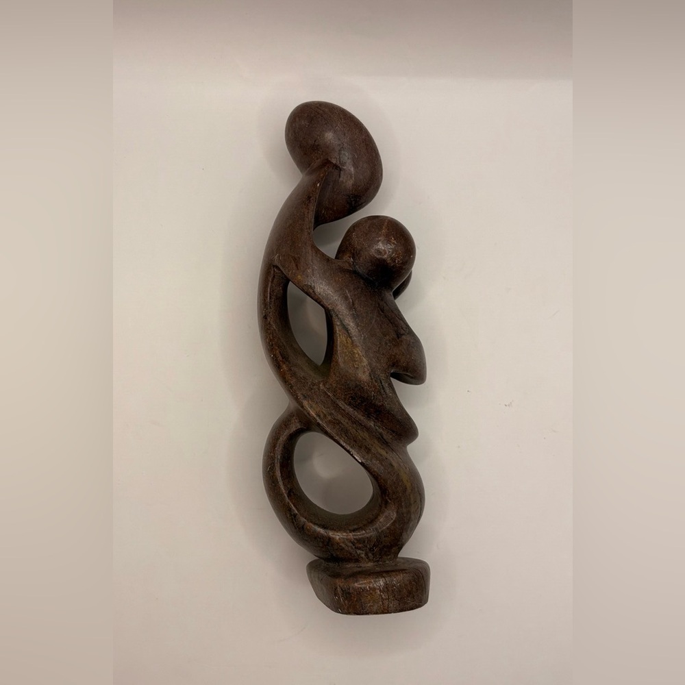 Carved Stone Mother and Children Sculpture